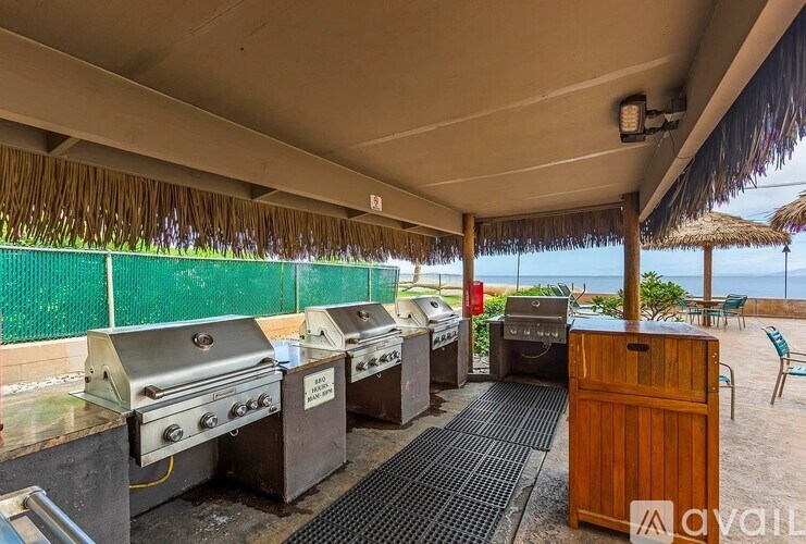 A living room with a view of the ocean through large windows.