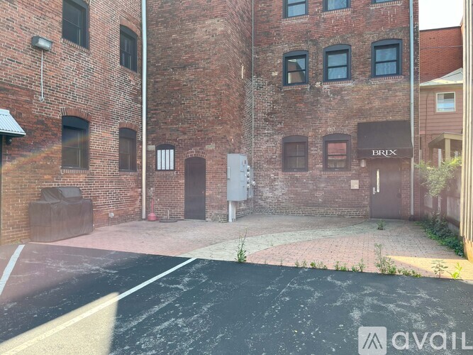 A brick building with a sign that says "BRICK" on it.