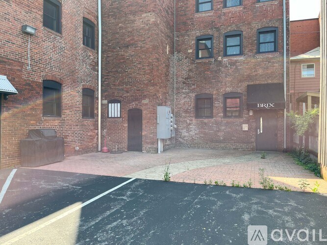 A brick building with a sign that says "BRICK" on it.