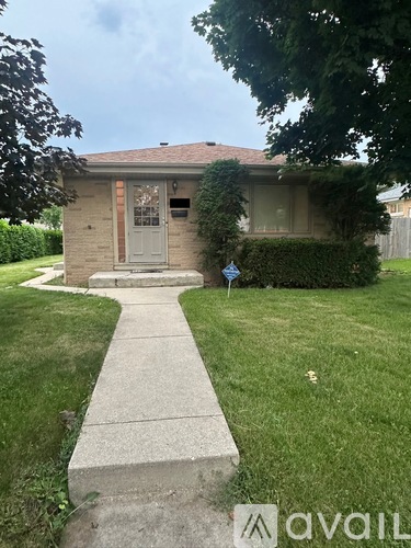 A house with a grey door and a small porch.
