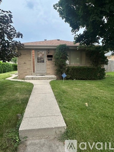 A house with a grey door and a small porch.