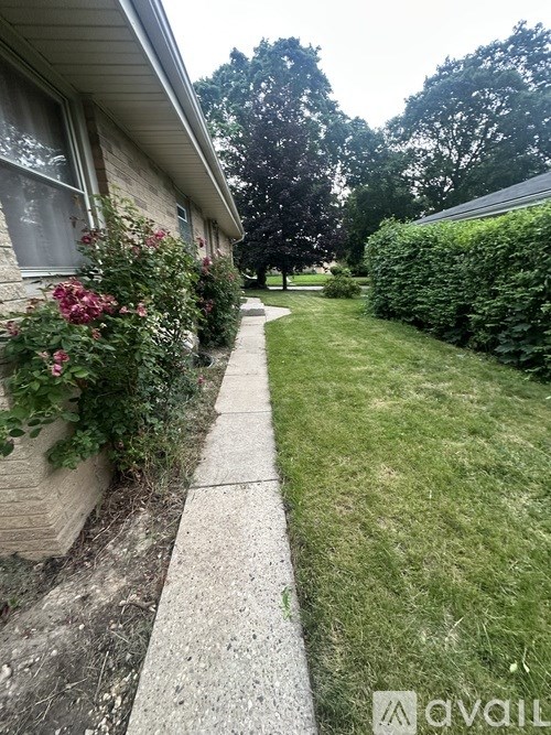 A house with a white wall and a window with a white frame.