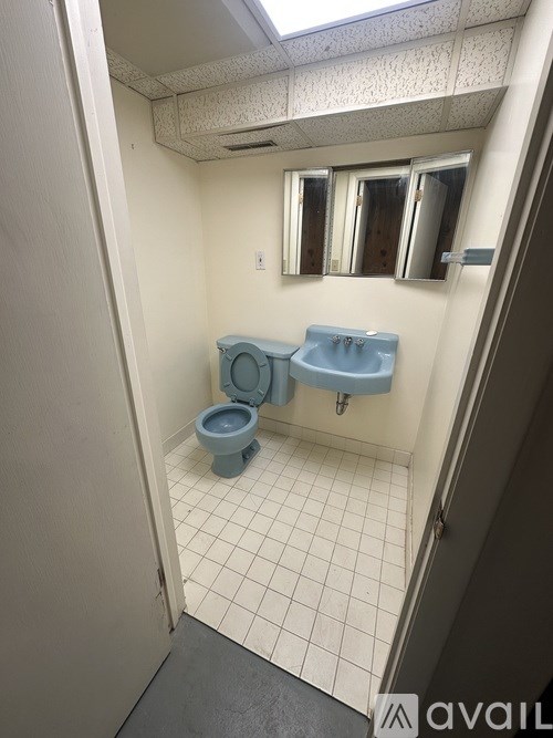 A bathroom with a toilet and sink.