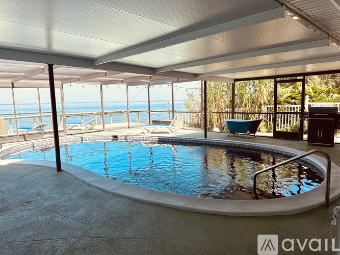A round above ground pool with a metal railing around it.