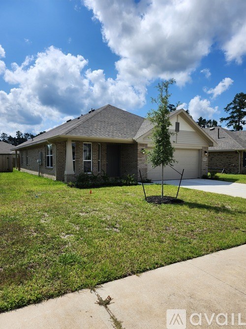 A house with a tree in front of it.