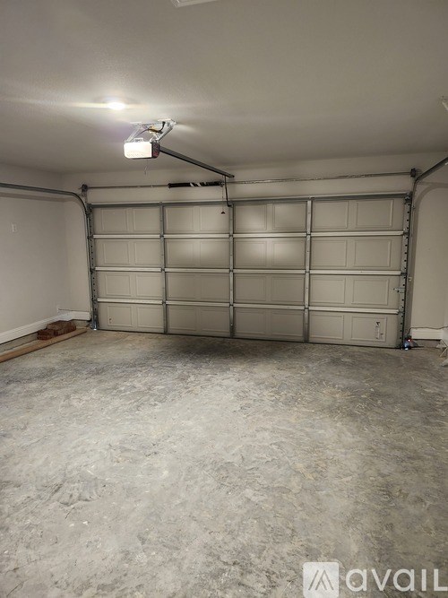 A garage with a concrete floor and a white ceiling.