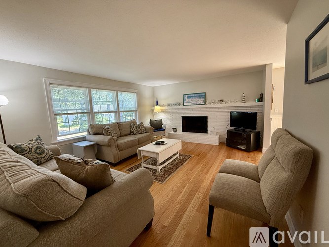 A living room with a fireplace and a couch.