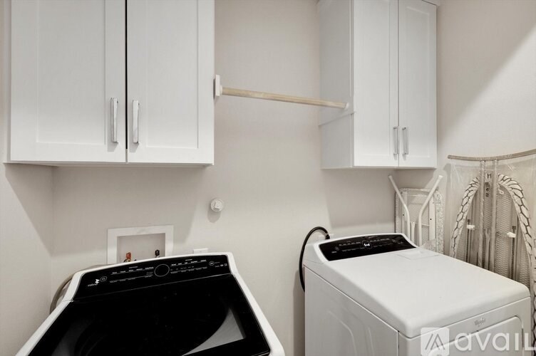 A laundry room with a washer and dryer.