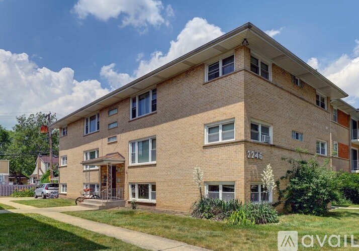 A brick apartment building with the number 2246 on the front.