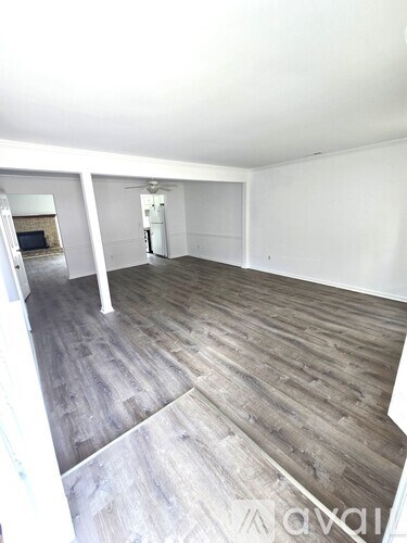 A backyard with a wooden fence and a shed.