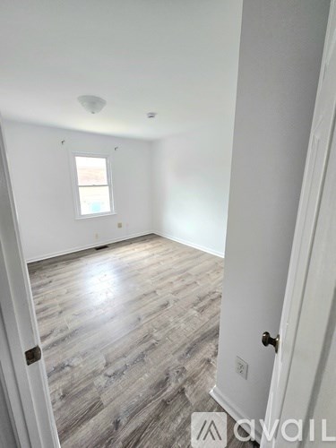 A room with a door and a window.