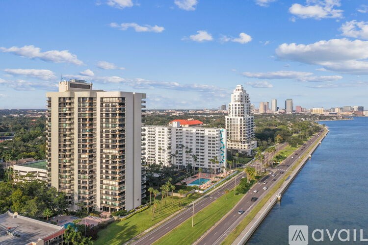 A cityscape with a river running through it.