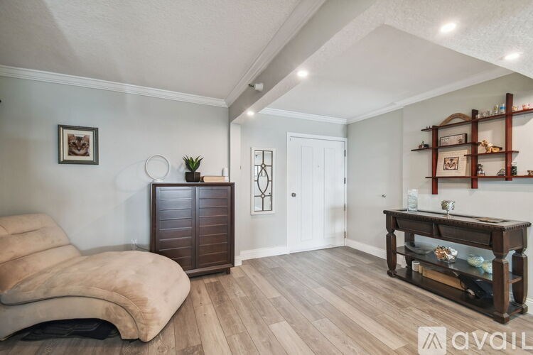 A living room with a brown sofa and a wooden coffee table.