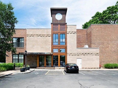 A building with a large circular window on the top of it.