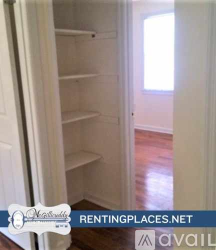 A mobile home with a porch and a sign that says "McGillivary Renting Places.net".