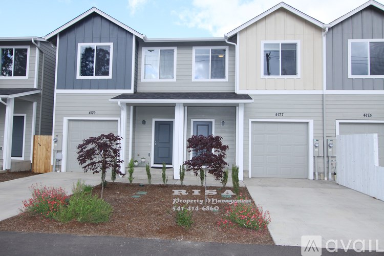 A row of houses with a sign in front of them that says "Available".