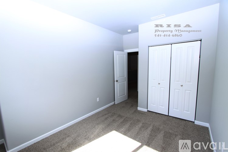 A white wall with a sign that says RISA Property Management.