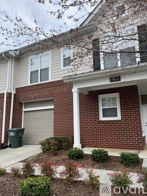 A house with a garage and a window is shown.