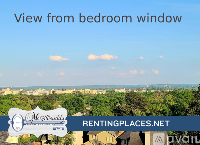 A view from a bedroom window overlooking a residential area.