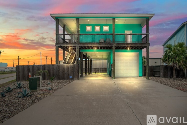 A modern house with a balcony and a garage is shown in the image.