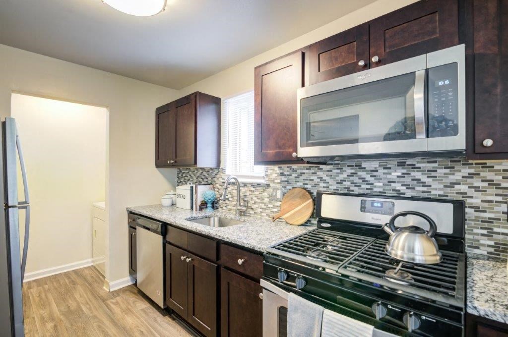 a kitchen with a stove and a microwave