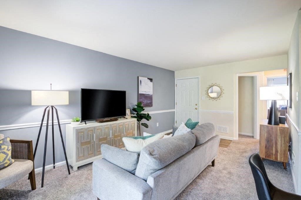 a living room with a couch and a tv