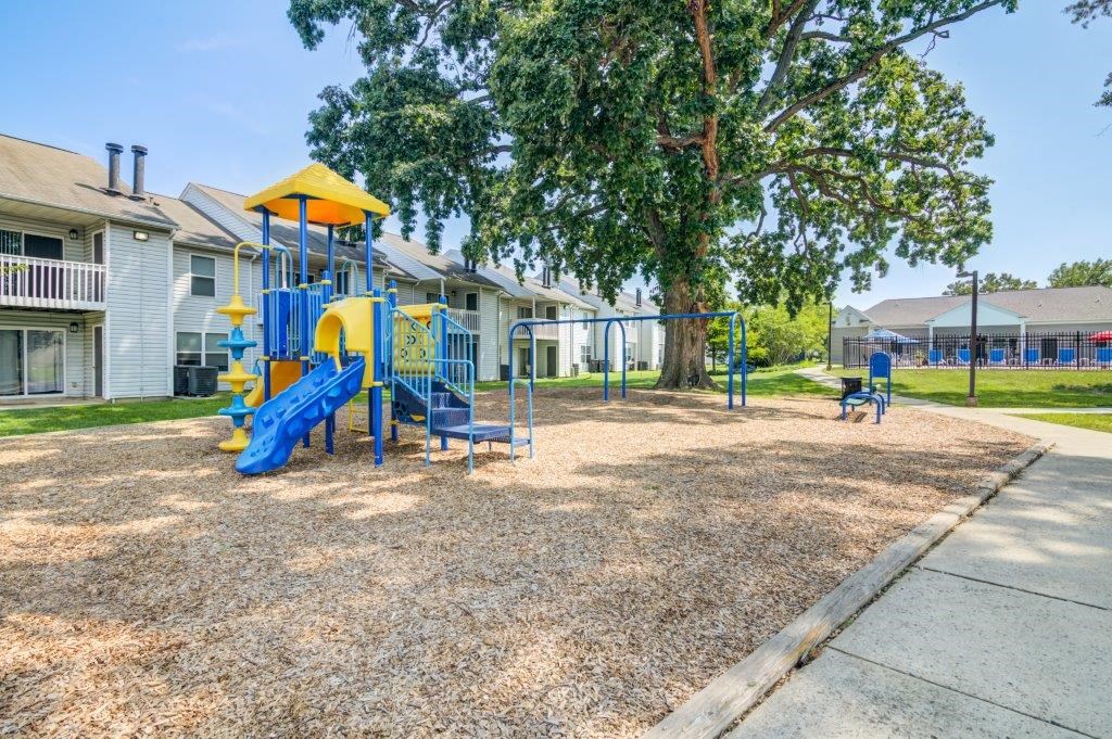 our playground is in front of our apartments and has a blue swing set