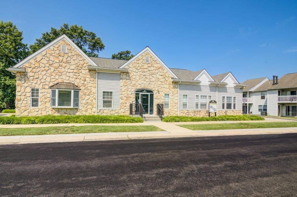 a house with a driveway and a street in front of it