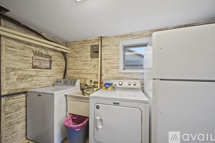 A small laundry room with a washer and dryer.
