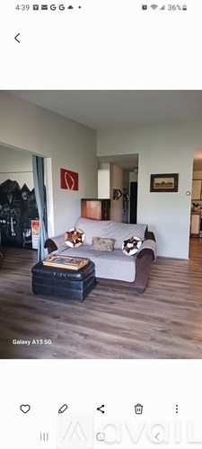 A living room with a couch and a coffee table.