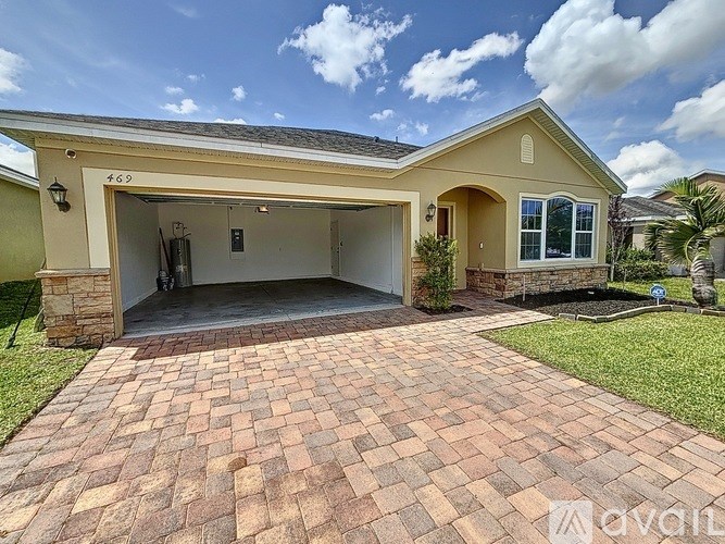 A house with a driveway in front of it.