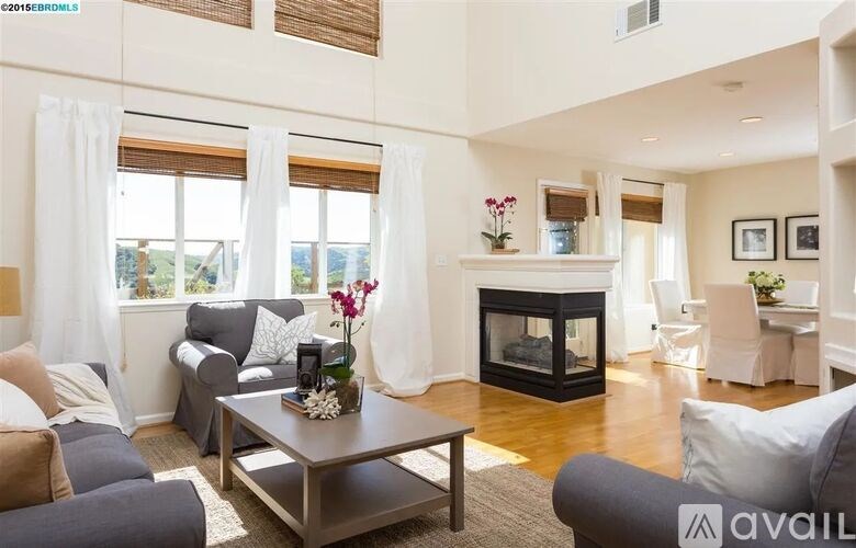 A living room with a fireplace and a couch.
