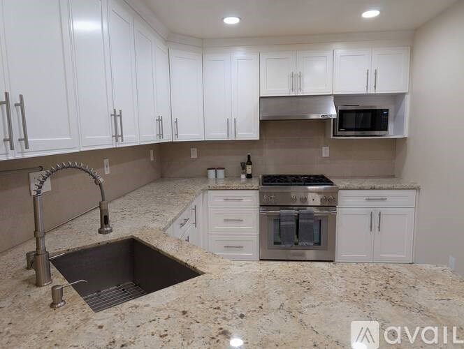 A kitchen under construction with a sink and cabinets.