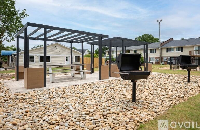 A playground with a swing set and a slide.