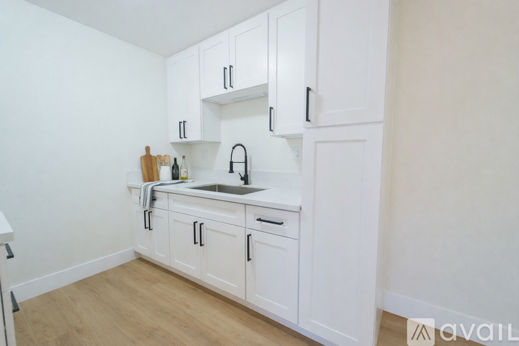 A laundry room with washers and dryers.