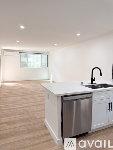 A modern kitchen with a dishwasher and sink.