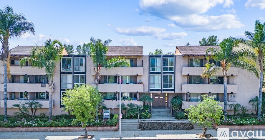 A building with a sign that says "AVAIL" in front of it.