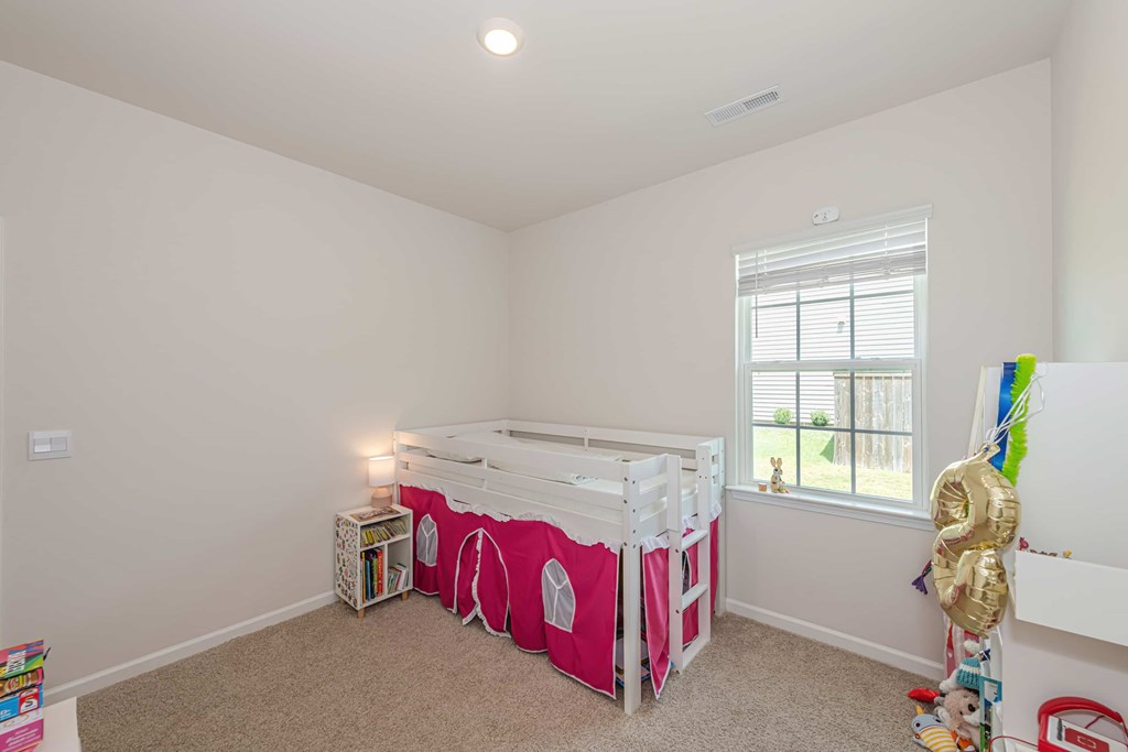 A baby room with a crib and a changing table.