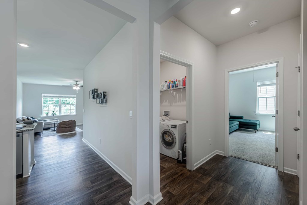 A laundry room with a washer and dryer in it.