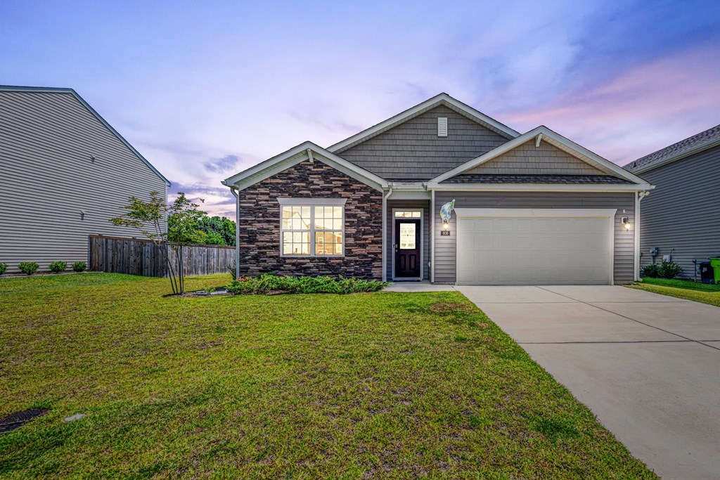 A house with a garage and a driveway.