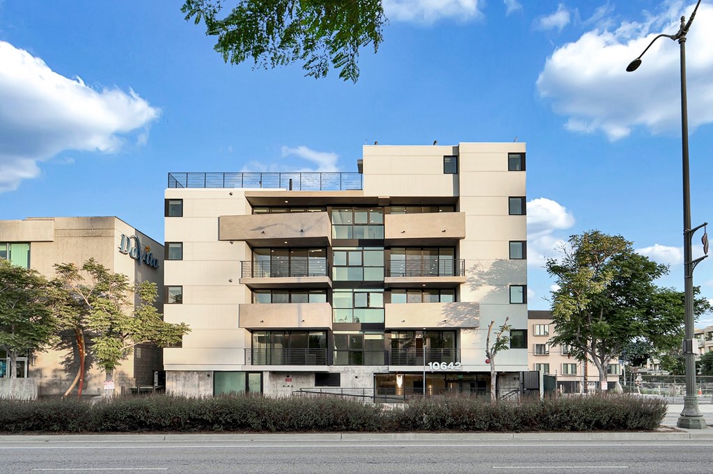 A modern building with a flat roof and large windows.