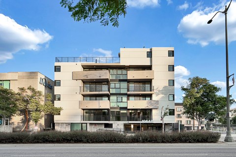 A modern building with a flat roof and large windows.