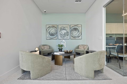 A living room with a grey sofa and a coffee table.