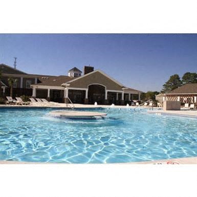 a large swimming pool with a boat in it