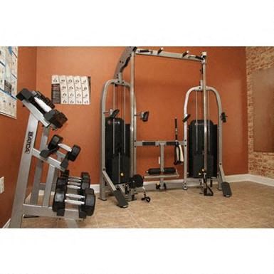 a home gym with weights and other equipment