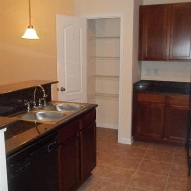 a kitchen with a sink and a refrigerator