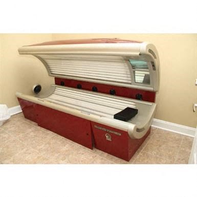 a red and white toaster oven sitting in a room
