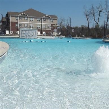 a large pool of water in front of a building