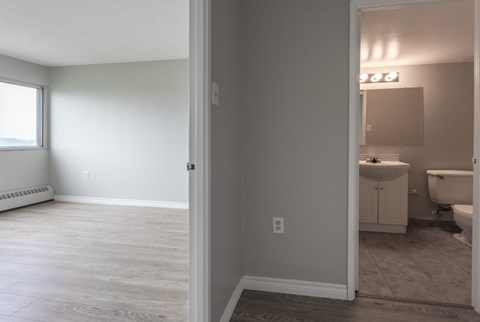 a view of the bathroom from the living room with the door open