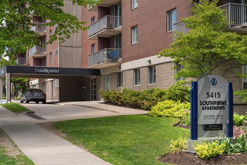 an apartment building with a sign that says salsboro apartments